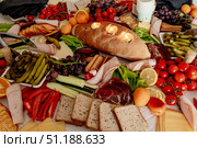 Served table with pastries, vegetables and delicacy meats for coffee break event. Стоковое фото, фотограф Spirit River / Фотобанк Лори