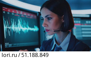 A tech specialist focuses intently on data visualizations and audio signals inside a modern control center, showcasing advanced analytics. Стоковое AI-видео, аниматор Данила Большаков / Фотобанк Лори