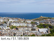 St Ives, Cornwall coastal townscape with harbour, rooftops and blue Atlantic horizon. Стоковое фото, фотограф Zydrius Tartenis / Фотобанк Лори