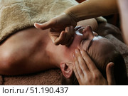 Revitalizing Facial Massage Experience in a Serene Spa Setting Promotes Relaxation and Beauty. Стоковое фото, фотограф Aleksandr Golubev / Фотобанк Лори