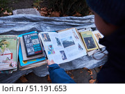 Tbilisi, Georgia - January 04, 2023: Shota Rustaveli Avenue, sale of old books. Редакционное фото, фотограф Наталия Кирсанова / Фотобанк Лори