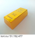 Golden ingot of the highest standard on a white background. Стоковое фото, фотограф Быканова Ольга / Фотобанк Лори