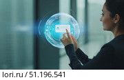 In a sleek office, a woman engages with a holographic interface, exploring data and insights in a futuristic setting. Стоковое AI-видео, аниматор Данила Большаков / Фотобанк Лори