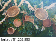 Outdoor decor made of wicker baskets. Стоковое фото, фотограф Наталия Кирсанова / Фотобанк Лори