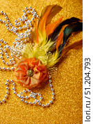 Festive, colorful Mardi Gras or carnivale mask on golden background. Venetian masks. Стоковое фото, фотограф Ирина Буракова / Фотобанк Лори