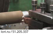 processing of cylindrical metal blanks on a factory lathe. Стоковое видео, видеограф Алексей Сергеев / Фотобанк Лори