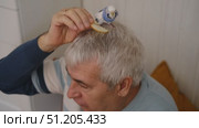 Budgerigar playing with senior man. Budgie. Funny blue purple parakeet sitting on old owner. Cute bird having fun with elderly male. Friendship, relationship with Pets. Cute domestic animals. Стоковое видео, видеограф Марина Демидюк / Фотобанк Лори