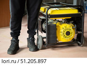 Portable gasoline generator.The use of an autonomous energy source. An additional source of energy. Стоковое фото, фотограф Александр Поташев / Фотобанк Лори