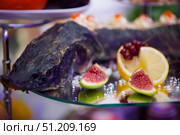 The food in the restaurant fish sturgeon on the tray. Стоковое фото, фотограф Наталия Кирсанова / Фотобанк Лори