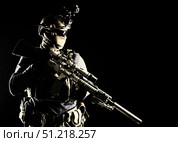 Disguised marksman holding sniper rifle with optical sight and silencer. Oleg Zabielin / Stocktrek Images/TASS. Стоковое фото, агентство ТАСС / Фотобанк Лори