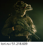 Special forces fighter armed with submachine gun, looking through night vision goggles. Oleg Zabielin / Stocktrek Images/TASS. Стоковое фото, агентство ТАСС / Фотобанк Лори