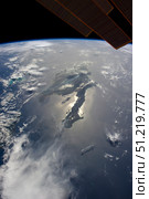 The island of Hispaniola with sunglint illuminating the peninsula of Haiti. Stocktrek Images, Inc./TASS. Стоковое фото, агентство ТАСС / Фотобанк Лори