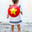 Hanoi, Vietnam - 29.04.2025: Rear view portrait of cute little girl in white dress and red Non la - traditional Vietnamese straw hat standing near lake in Hanoi on sunny day. Стоковое фото, фотограф Ирина Михайличенко / Фотобанк Лори
