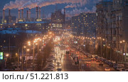 Street lights illuminating urban roadside with moving and parked vehicles, industrial chimneys releasing smoke against dusky sky in winter moscow cityscape. Стоковое AI-видео, аниматор Юрий Поздников / Фотобанк Лори
