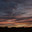 Bright blue-red sunset sky on summer evening, and dark silhouette of two domes of Orthodox church. Стоковое фото, фотограф irisff / Фотобанк Лори