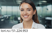 Professional Businesswoman Smiling in a Modern Office, Exuding Confidence and Success. Confident woman wearing a white formal wear in a contemporary work settings, embodying professionalism positivity. Стоковое AI-видео, аниматор Марина Демидюк / Фотобанк Лори