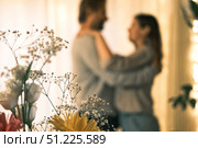 Emotional Dance. Middle-aged Couple Dancing Together Embrace at Home. Mature Couple dancing bonding, smiling and moving to the rhythm in a romantic vibe enjoying their anniversary. Active relationship. Стоковое фото, фотограф Марина Демидюк / Фотобанк Лори