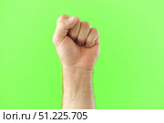Male Hand Making Rise Up Sign Symbol. Chroma Key Green Screen Background. Gesture Movement. Body Language. 4K Footage. Close Up. Raised Hand. Clenched Closed Fist. Raised Up. Human Equal Rights. Vote. Стоковое фото, фотограф Марина Демидюк / Фотобанк Лори