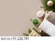Christmas Spa concept with gift and cosmetic aroma oil, pine cones. Стоковое фото, фотограф Светлана Лажко / Фотобанк Лори