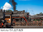 An old Soviet steam locomotive of the L series. The Ruskeala Express retro train is at the Sortavala station. Russia, Republic of Karelia, Sortavala, August 12, 2025. Редакционное фото, фотограф Photojuli / Фотобанк Лори