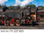 An old Soviet steam locomotive of the L series. The Ruskeala Express retro train is at the Sortavala station. Russia, Republic of Karelia, Sortavala, August 12, 2025. Редакционное фото, фотограф Photojuli / Фотобанк Лори