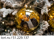 A decorated Christmas tree of the Mosfilm film company with portraits of actors from popular Soviet films, in the GUM store in the center of Moscow. Russia, Moscow, January 9, 2025. Редакционное фото, фотограф Photojuli / Фотобанк Лори
