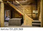 Yuryevets, Ivanovo region, Russia, July 24, 2025: Interior old wooden merchant's storehouse of Katyushin estate from 19th century, now modern exhibition space. Редакционное фото, фотограф Алексей Антипов / Фотобанк Лори