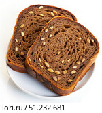 Two Slices of Dark Rye Bread With Sunflower Seeds on a White Plate. Generative AI. Стоковое AI-изображение, AI-художник Roman Zavorotny / Фотобанк Лори