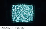 Old analog television showing abstract pixelated noise pattern. Стоковое фото, фотограф David Kashakhi / Фотобанк Лори