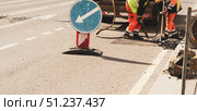 worker uses jackhammer to break road asphalt. Стоковое фото, фотограф Андрей Митин / Фотобанк Лори