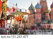 Holiday decorations on the streets of Moscow. St. Basil's Cathedral. Beautiful Christmas background 2026. Russia, Moscow, January 9, 2025. Редакционное фото, фотограф Photojuli / Фотобанк Лори