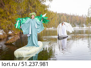 Girls in white and green dresses embodying the meeting of winter and spring on a serene lake. Стоковое фото, фотограф Кривошеина Елена Леонидовна / Фотобанк Лори