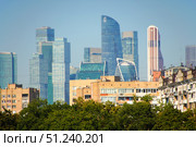 An urban landscape with tall buildings of Moscow City and a clear blue sky. Russia. Moscow. 24.08.25. Редакционное фото, фотограф Ярославский Максим / Фотобанк Лори