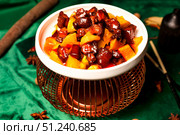 Gourmet Pork and Pumpkin Stew Presentation at a Distinguished Chinese Dining Establishment. Стоковое фото, фотограф Aleksandr Golubev / Фотобанк Лори