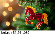 Christmas tree toy - fire horse on a Christmas tree branch. Lights in the background. Copy space. AI generative. Стоковое AI-изображение, AI-художник Роман Дзюбало / Фотобанк Лори