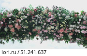 Beautiful flower arrangement hanging from ceiling creating stunning floral decoration. Стоковое видео, видеограф Mikhail Davidovich / Фотобанк Лори