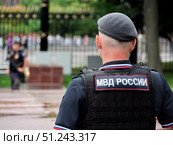 Russian Police Officer in Uniform at Public Event. Редакционное фото, фотограф Sergakoff / Фотобанк Лори