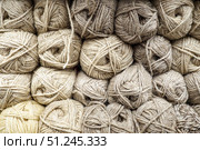 Background from wool yarn, balls for knitting, beige threads from natural wool. Стоковое фото, фотограф Зарифа Арсланова / Фотобанк Лори