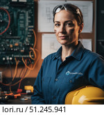 Profession engineer - portrait of young woman in work clothes. AI generated. Стоковое AI-изображение, AI-художник Андрей Аркуша / Фотобанк Лори
