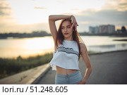 Young beautiful caucasian blonde girl listening to music with smartphone walking and dance in the city with headphones smiling - relax, youth, emancipation concept. Стоковое фото, фотограф Арзюков Вадим Николаевич / Фотобанк Лори