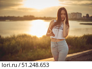 Young beautiful caucasian girl listening to music with smartphone walking in the city with headphones smiling - relax, youth, emancipation concept. Стоковое фото, фотограф Арзюков Вадим Николаевич / Фотобанк Лори