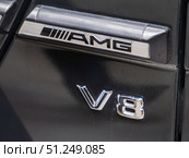 Close-Up View of AMG V8 Engine Badge (2024 год). Редакционное фото, фотограф Sergakoff / Фотобанк Лори