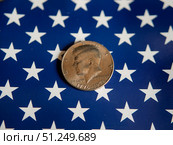 Kennedy Half Dollar Coin on American Flag Background. Стоковое фото, фотограф Sergakoff / Фотобанк Лори