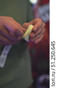 Hands skillfully handling ticket rolls, showcasing the intricate process of preparation and organization. Стоковое видео, видеограф Данил Руденко / Фотобанк Лори