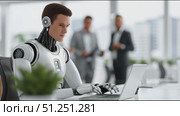 Futuristic humanoid robot with sleek design is working on a laptop in a modern office environment, surrounded by professionals engaged in discussion, showcasing advanced technology integration. Стоковое AI-видео, аниматор Ирина Ручушкина / Фотобанк Лори