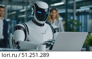 Futuristic humanoid robot working on laptop in modern office environment, surrounded by business professionals, showcasing advanced technology and collaboration in a corporate setting. Стоковое AI-видео, аниматор Ирина Ручушкина / Фотобанк Лори