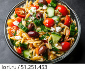 Fresh orzo salad with vegetables and feta. Стоковое AI-изображение, AI-художник Татьяна  Бральнина / Фотобанк Лори