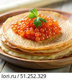 Stack of Thin Pancakes Topped With Caviar and Parsley on a Wooden Plate. Generative AI. Стоковое AI-изображение, AI-художник Roman Zavorotny / Фотобанк Лори