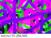 Vibrant Neon Graffiti Art in Pink, Green, and Purple for Urban Y2K Aesthetic. Стоковое фото, фотограф Александра Конопля / Фотобанк Лори