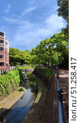 Nagasaki, Japan - May 12, 2025. Canal in the city center. Стоковое фото, фотограф Константин Никитеев / Фотобанк Лори
